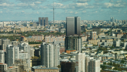 View of Moscow cityscape, a mixture of buildings against the cloudy blue sky