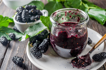 Mulberry Chutney or Jam, with fresh Mulberries, wooden rustic background