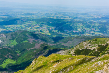 Obraz premium Located in the valley, the village in Podhale seen from the trail in the Tatras.