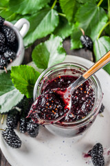 Mulberry Chutney or Jam, with fresh Mulberries, wooden rustic background
