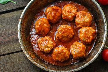 meatballs in tomato sauce (meat dish). food background. top view. copy space