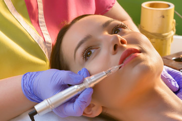 Woman Getting Pigmentation Tattoo Procedure