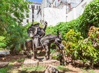 Cuba, Old Havana. Statue, made from metal, of character Sancho Panza on the dunkey. Sancho Panza is a fictional character in the novel Don Quixote written by Spanish author.