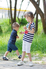 Two happy children playing at street