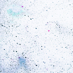 Foam and bubbles on the surface of bath bomb in water
