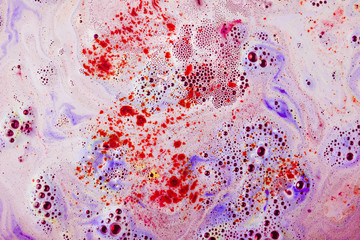 Red and purple textured surface with dissolve bathbomb