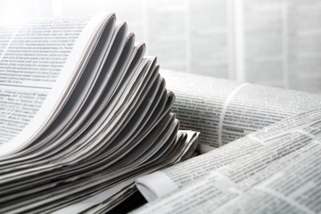 Fototapeta premium piles of numerous printed newspapers