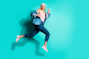 Full length body size profile side view of her she nice attractive lovely cheerful cheery glad girl having fun spring marathon isolated over bright vivid shine blue green turquoise background