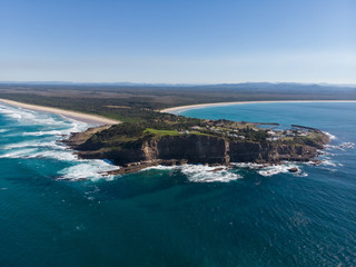 Fototapeta na wymiar Drone picture of two huge beach in a coast with forest and city
