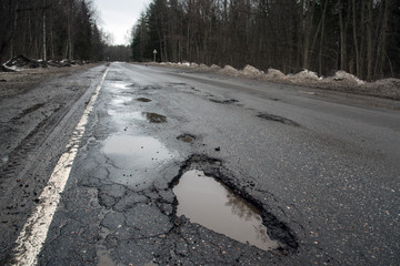 broken road, potholes, puddles, bad russian highway