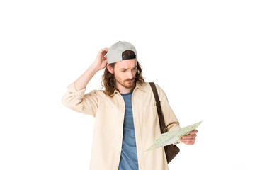 confused young man holding map isolated on white
