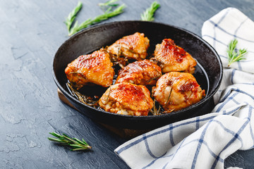 Delicious fried chicken thighs in a cast iron skillet