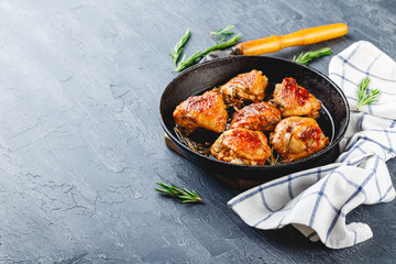 Delicious fried chicken thighs in a cast iron skillet