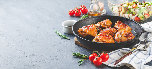Delicious fried chicken thighs in a cast iron skillet