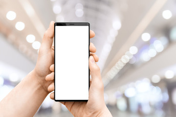 Man`s hand holding mobile smart phone.