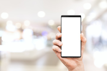 Hand holding mobile smart phone with blank screen