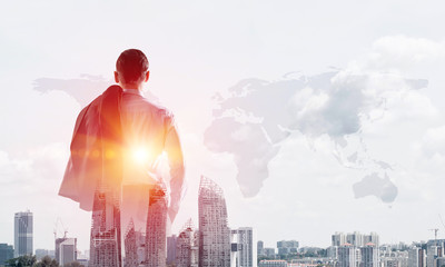 Concept of business success and control with confident boss against cityscape background