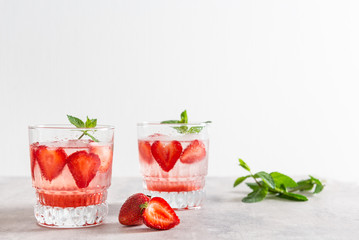 Refreshing Ice Cold Strawberry Lemonade on white background. Copy space