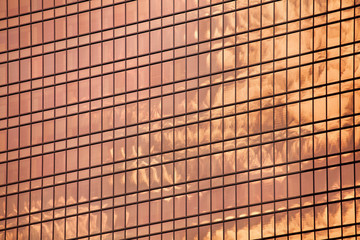 Red glass skyscraper wall surface close up, modern business center view, financial city district, commercial downtown design, building facade, art geometric pattern, graphic lines texture, copy space - Powered by Adobe