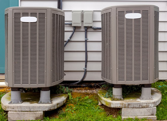 Two freestanding outdoor air conditioning units.