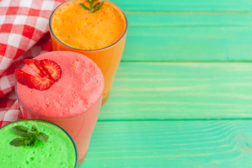 Row of healthy fresh fruit and vegetable smoothies