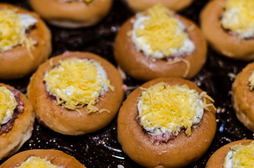 stuffed meat donut on a baking sheet