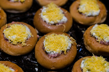 stuffed meat donut on a baking sheet