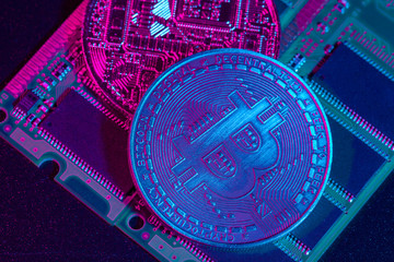 golden bitcoin and computer chip in background