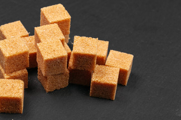 Rock sugar on dark background close up