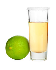 Shot of tequila with a slice of lime no white background