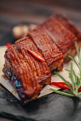 grilled beef steak with vegetables on gray slate background