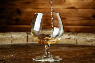 Double whiskey being poured into a glass