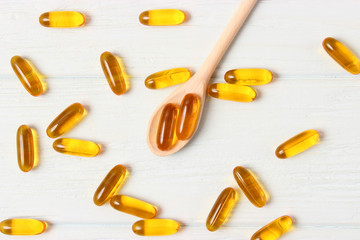 Omega-3 capsules on a colored background. Fish oil, healthy supplements