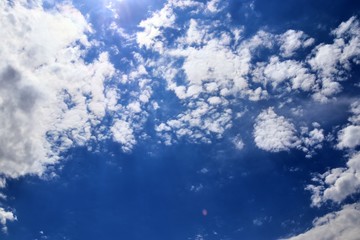 Beautiful white fluffy cloud formations on a deep blue sky
