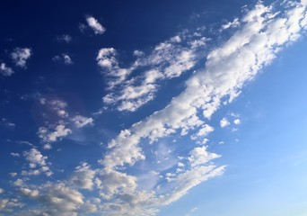 Beautiful white fluffy cloud formations on a deep blue sky