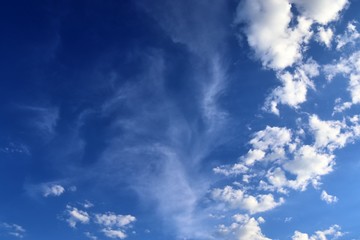 Beautiful white fluffy cloud formations on a deep blue sky