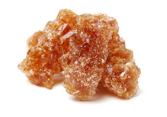 dark crystal sugar on white background