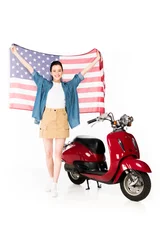 Foto op Plexiglas full length view of beautiful girl standing near red scooter and holding American flag isolated on white © LIGHTFIELD STUDIOS