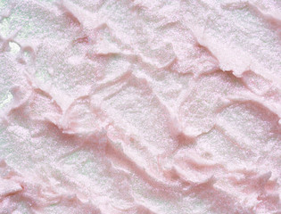 Pearly pink smears and texture of expensive face cream isolated on white background