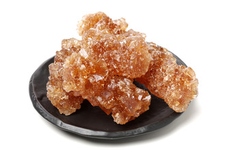 dark crystal sugar on white background