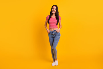 Full length body size view photo of pretty sweet lovely lady have weekend holiday spring she her good-looking confident dressed modern youth clothing isolated yellow bright background