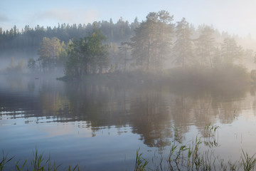 Naklejka na ściany i meble Foggy morning landscape on the lake, Valaam Island, Karelia, Russia.
