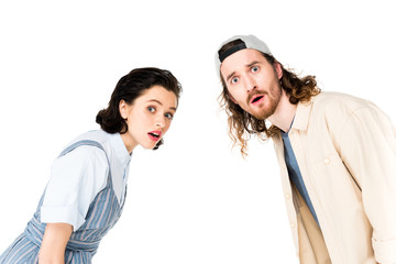 surprised young man and girl looking at camera isolated on white