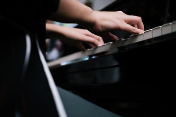 Beautiful woman playing piano, learn to play piano.