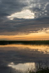 A Still Lake in Rural Latvia at Sunset