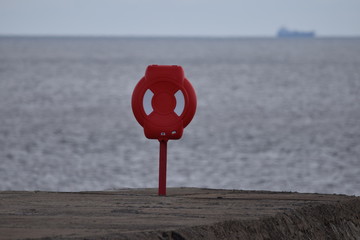 Life buoy at the end of a pier