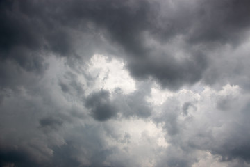 Fototapeta premium Light in the Dark and Dramatic Storm Clouds background