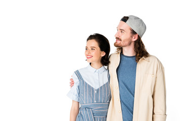 young couple looking away and hugging isolated on white