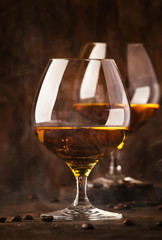 Armagnac, French grape brandy, strong alcoholic drink. Still life in vintage style, selective focus