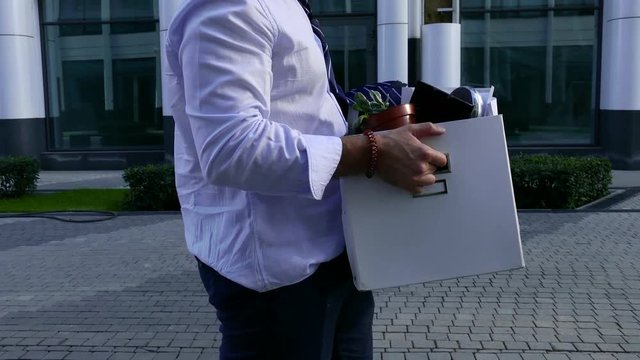 Fired Businessman Holding Box Of His Things